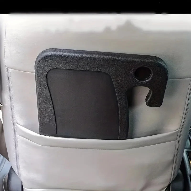 Car seat organizer with cup holder and storage space on a car seat.