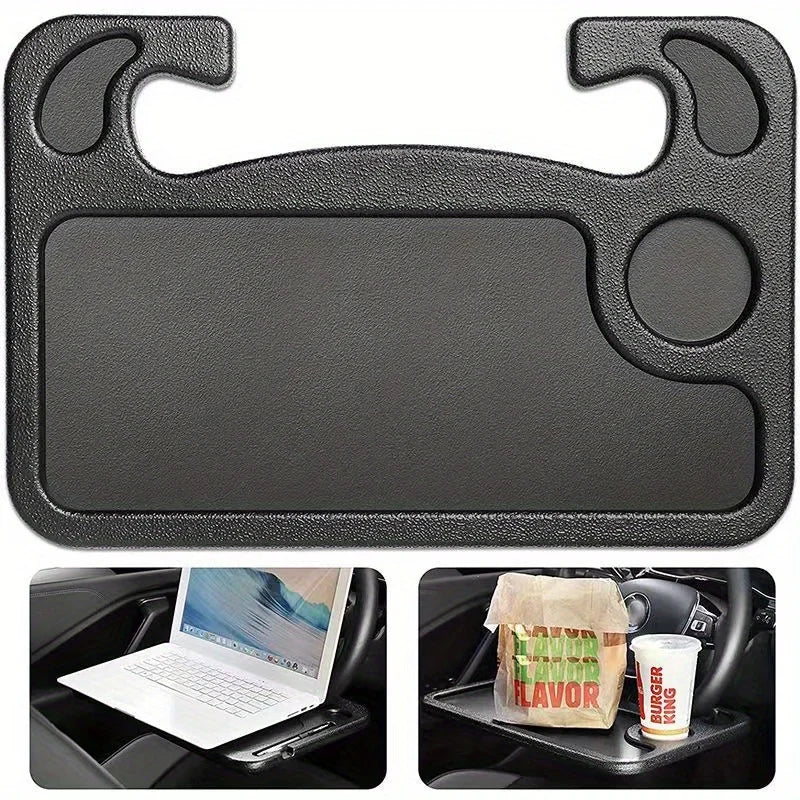 Black car tray with cup holder and laptop stand, used for dining in a car.
