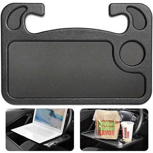 Black car tray with cup holder and laptop stand, used for dining in a car.